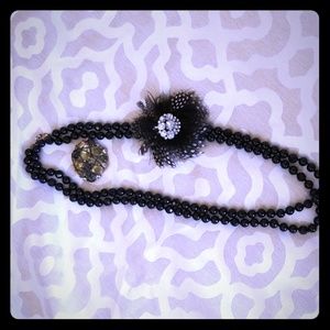 Beaded necklace with two brooches